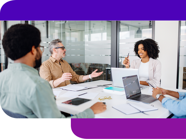 A businesswoman smiles and tells her coworkers about influencer, affiliate, and media alignment in a bright, modern office.