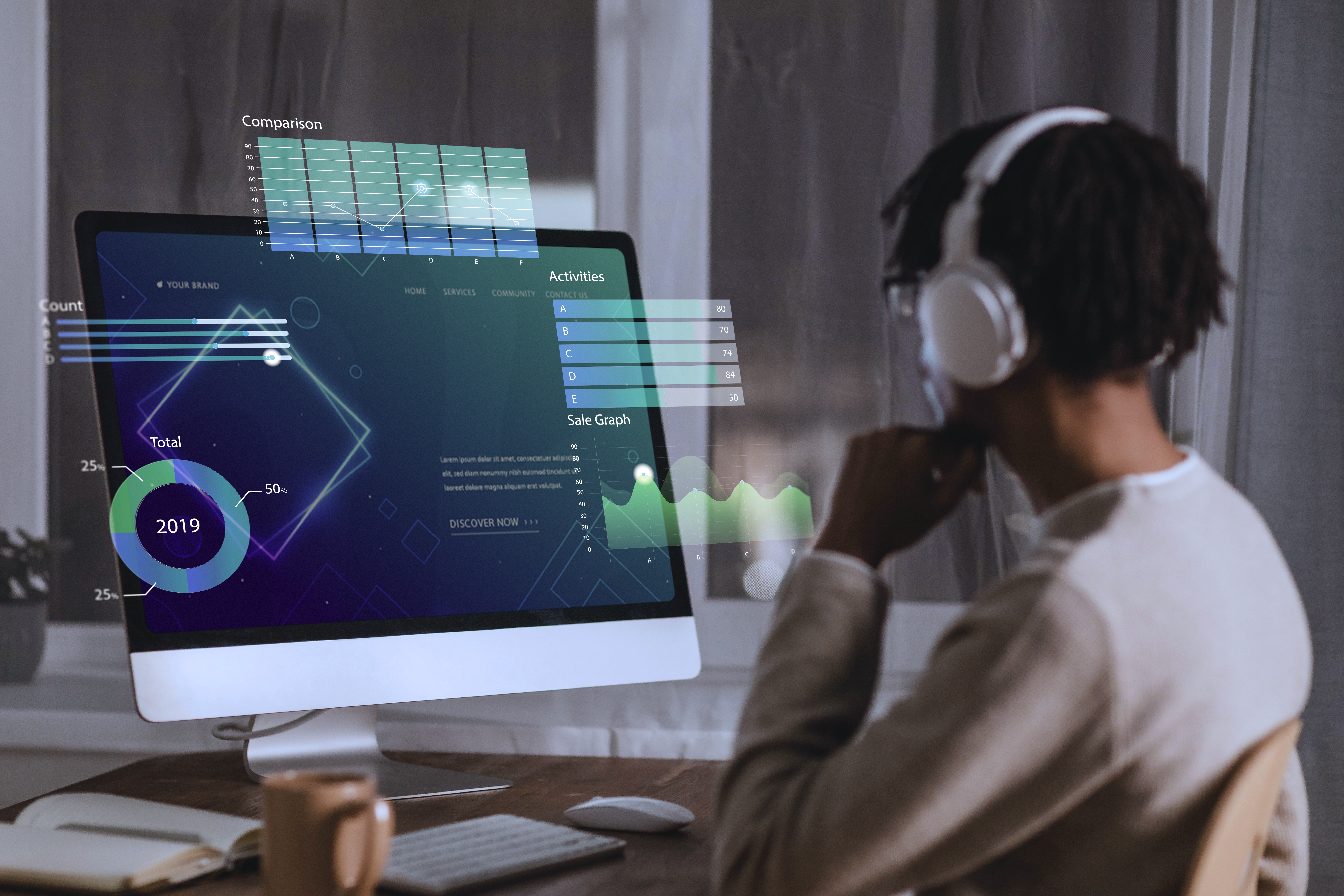 Man sits at computer, interfacing with AI search and discovery tools