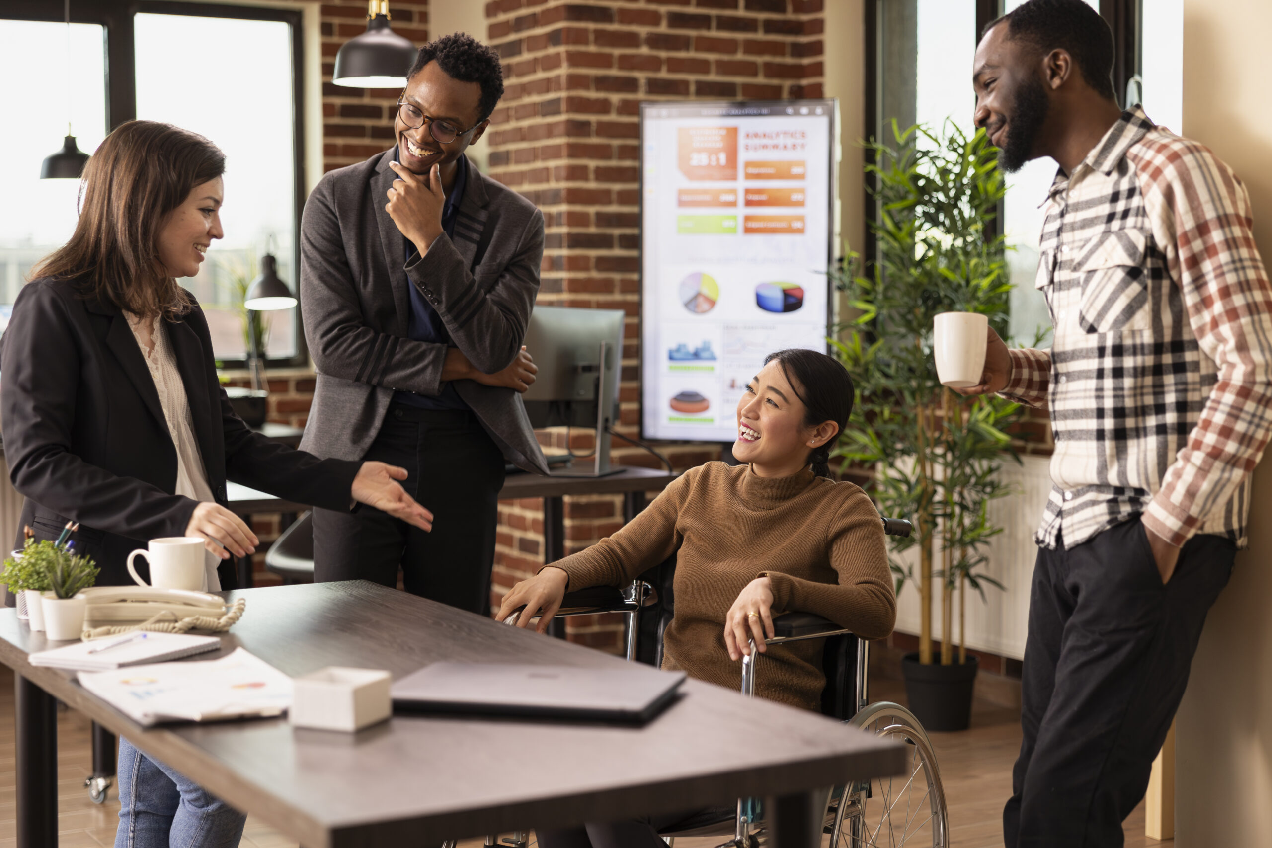A woman at a partner marketing agency talks about partner marketing strategy for brands with her coworkers.